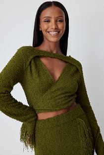 Pull cache-cœur en maille à franges
