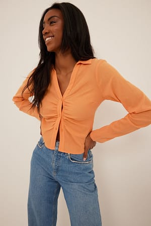 Peach Myk bomullsbluse med rynker foran