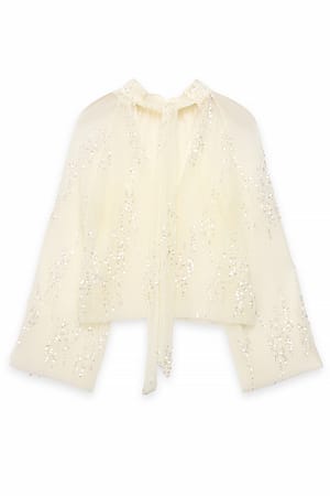 Offwhite Top met geplooid mesh en lovertjes