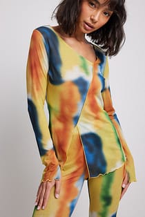 Doorschijnende asymmetrische top met print