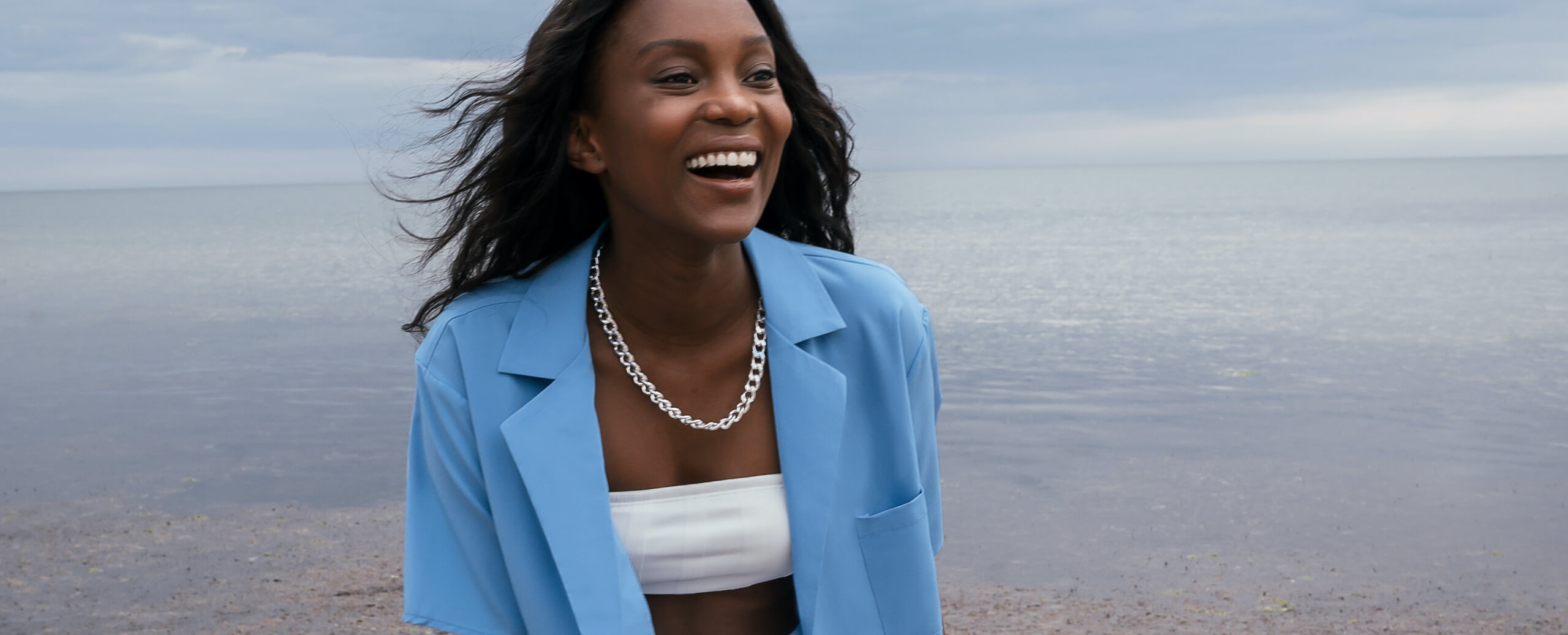 Happy woman by the sea