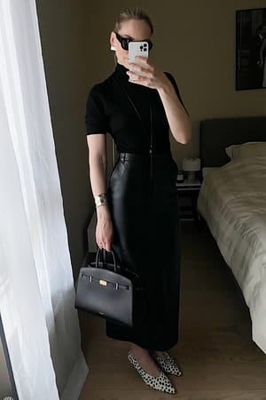 Black kurzärmeliges Top aus Merinowolle