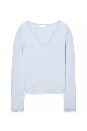 Light Blue Topp i jersey med lange ermer og blondedetaljer