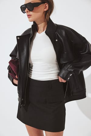Black Mini Skirt with Flap Pockets