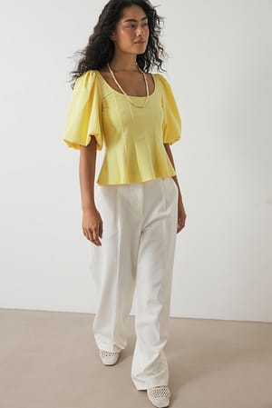 Yellow Plisserad topp med puffärmar