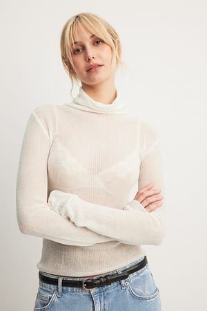 White Haut col roulé transparent en maille