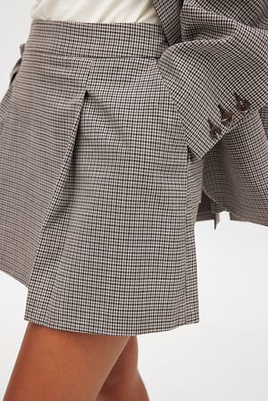 Check Minifalda plisada de cuadros pequeños