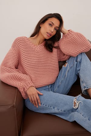 Rosette Sweater mit V-Ausschnitt