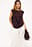Top med drapering og skarpe skuldre