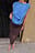 Top med drapering og skarpe skuldre
