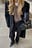 Oversized strikket ullgenser med V-hals
