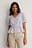 Bluse med flæser i broderie anglaise