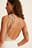 Top met one-shoulder en knoopdetail