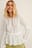 Gerecycleerde zwierige blouse met V-hals